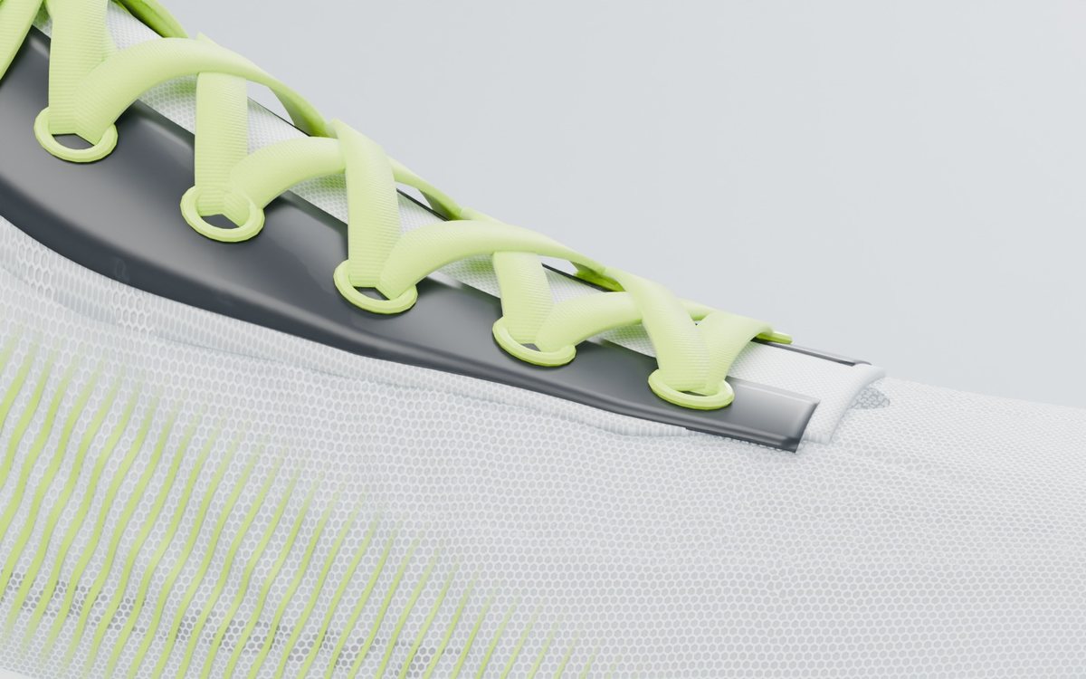Macro of the translucent hexagonal mesh upper with lime lacing